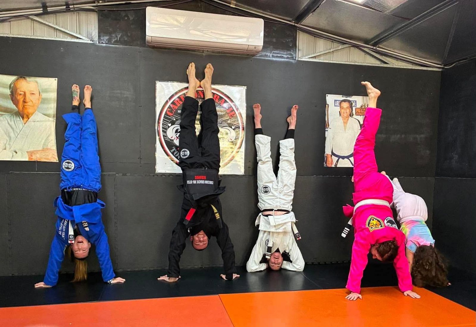 Members upside down against the wall at Carlson Gracie Redlands